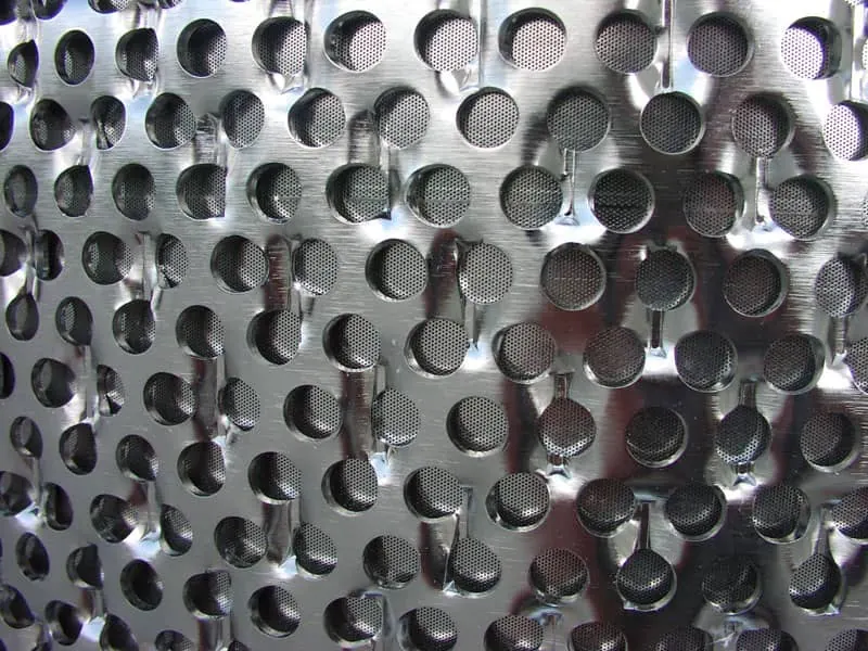 Electropolished stainless steel perforated screen plate for pulp and paper processing at Harrison Electropolishing