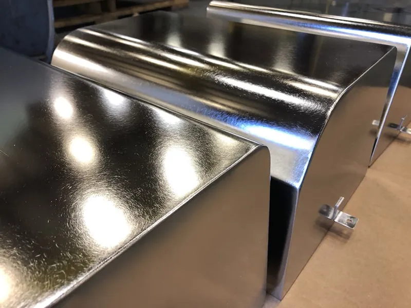 Mirror-polished stainless steel chute finished at Harrison Electropolishing